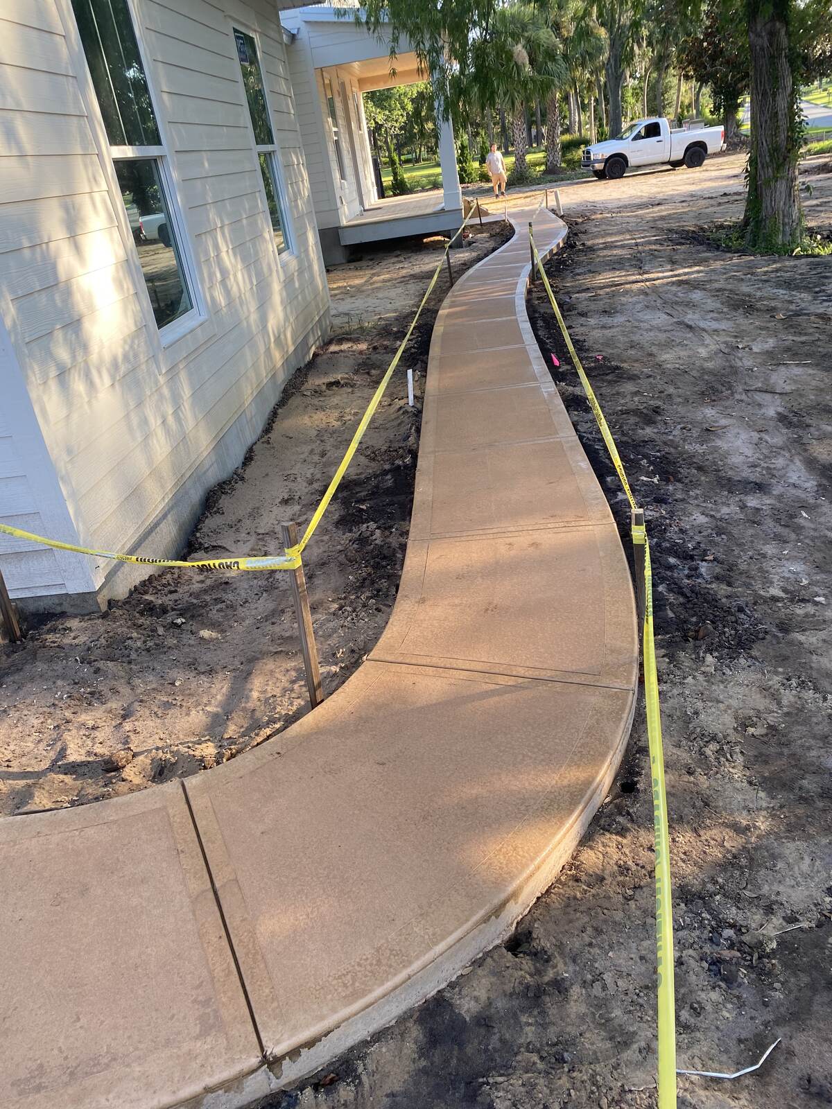 Curved stamped concrete walkway under construction